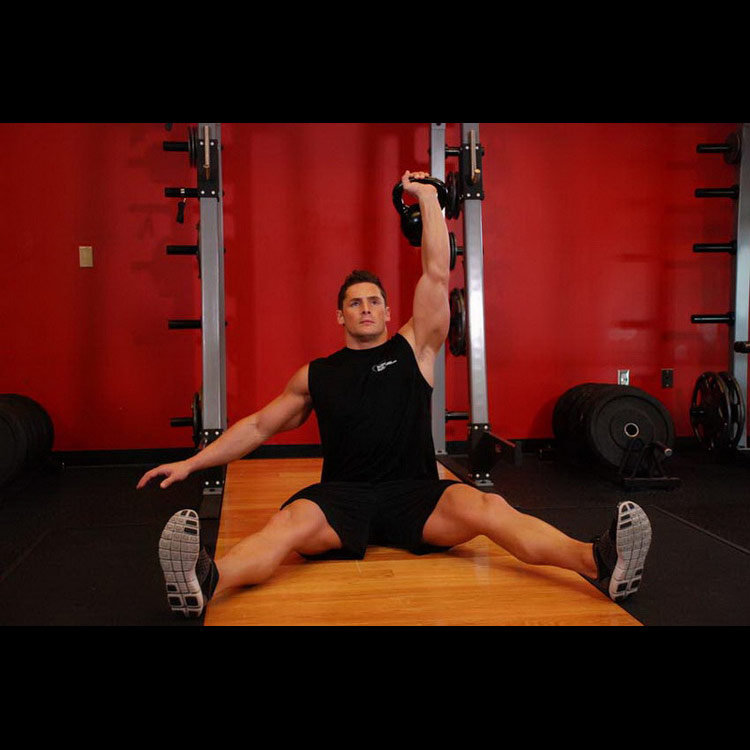 техника выполнения упражнения: Жим гири одной рукой сидя (Kettlebell Seated Press) на фото техника выполнения упражнения: Жим гири одной рукой сидя (Kettlebell Seated Press) на фото