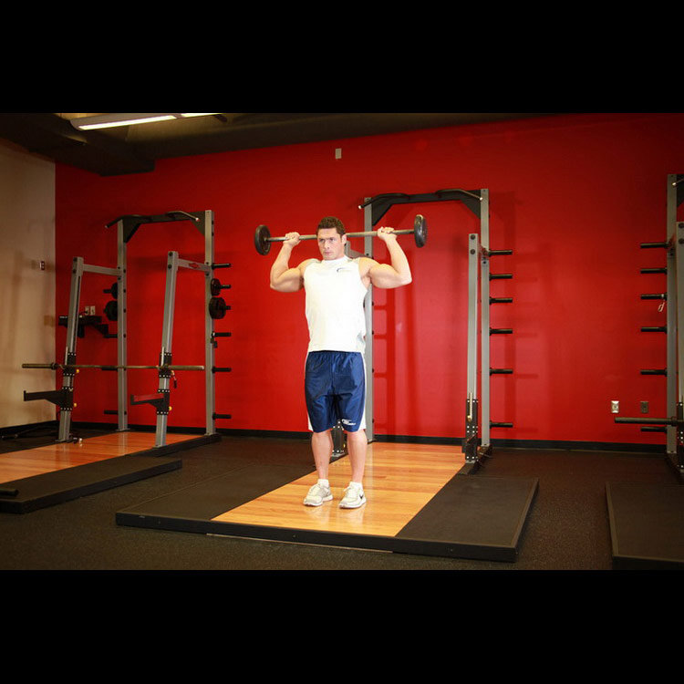 техника выполнения упражнения: Жим штанги стоя из-за головы (Standing Barbell Press Behind Neck) на фото