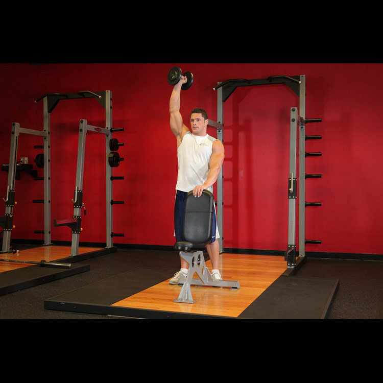 техника выполнения упражнения: Жим гантели стоя одной рукой (Standing Palm-In One-Arm Dumbbell Press) на фото