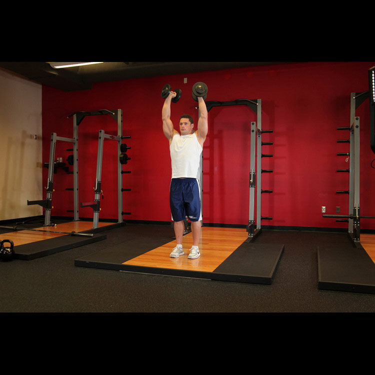 техника выполнения упражнения: Жим гантелей стоя (Standing Palms-In Dumbbell Press) на фото техника выполнения упражнения: Жим гантелей стоя (Standing Palms-In Dumbbell Press) на фото
