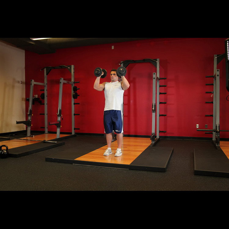техника выполнения упражнения: Жим гантелей стоя (Standing Palms-In Dumbbell Press) на фото техника выполнения упражнения: Жим гантелей стоя (Standing Palms-In Dumbbell Press) на фото